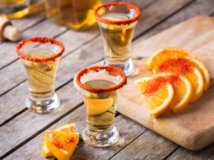 mexican-mezcal-or-mescal-shot-chili-pepper-and-orange-picture-id1313412873